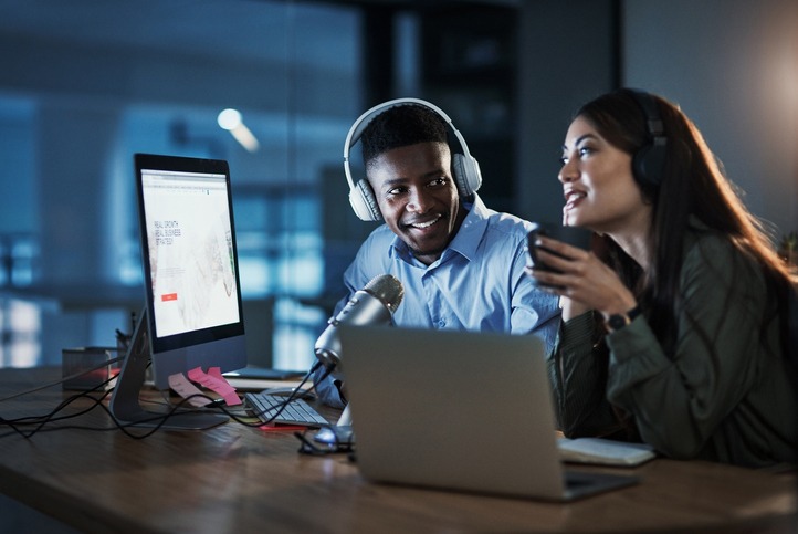two people are on a podcast show. Getting your subject matter experts on podcasts can bring more brand awareness to your company.