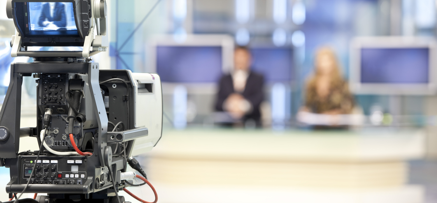 A generic image of a television camera and two blurred-out, indistinct anchors. A winning PR Pitch.