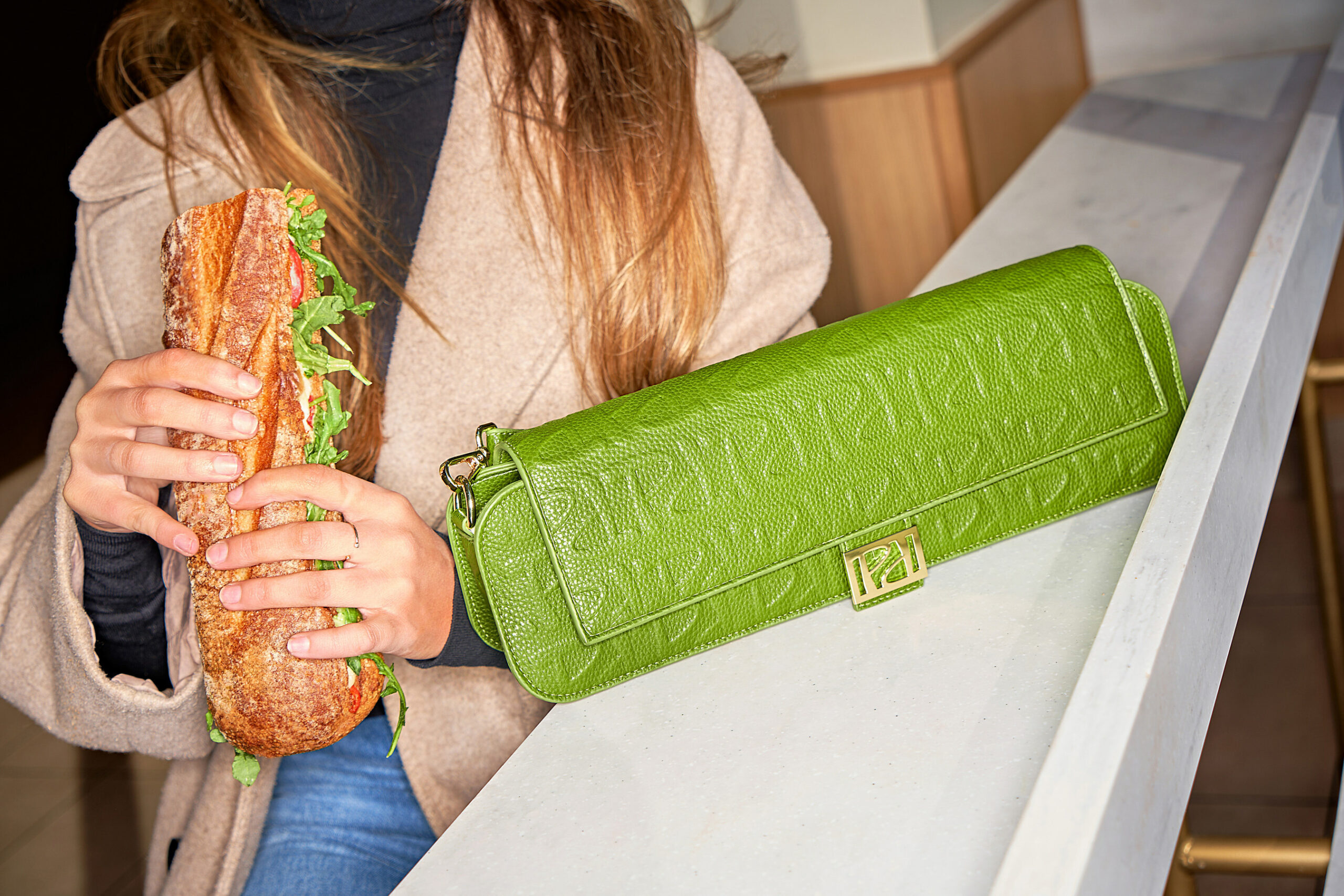 A Panera Bread purse perfectly fits a sub sandwich and is cute for a fashion statement. More food brands are becoming wearable.