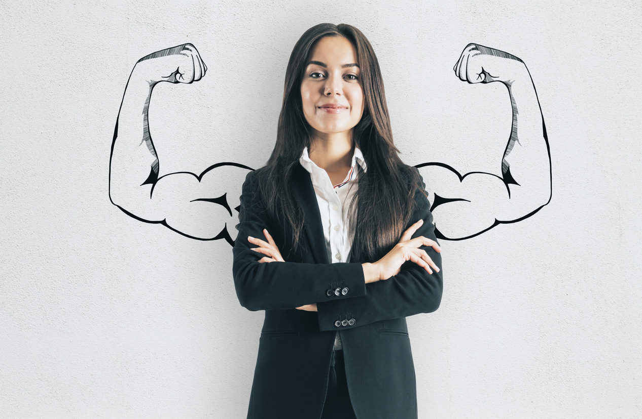 Portrait of attractive young businesswoman with drawn muscly arms. Confidence and strength concept. PR folks need to build their muscle in forging better relationships with journalists.