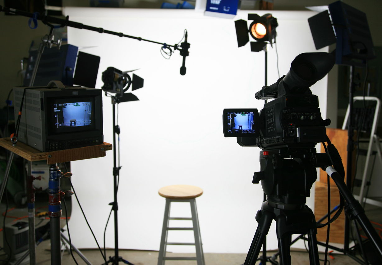 Studio interview setup in front of a white background with a stool waiting for oncamera talent. Influencers are in the middle of the writer's strike and some have turned down offers due to wanting to avoid appearing as a scab.