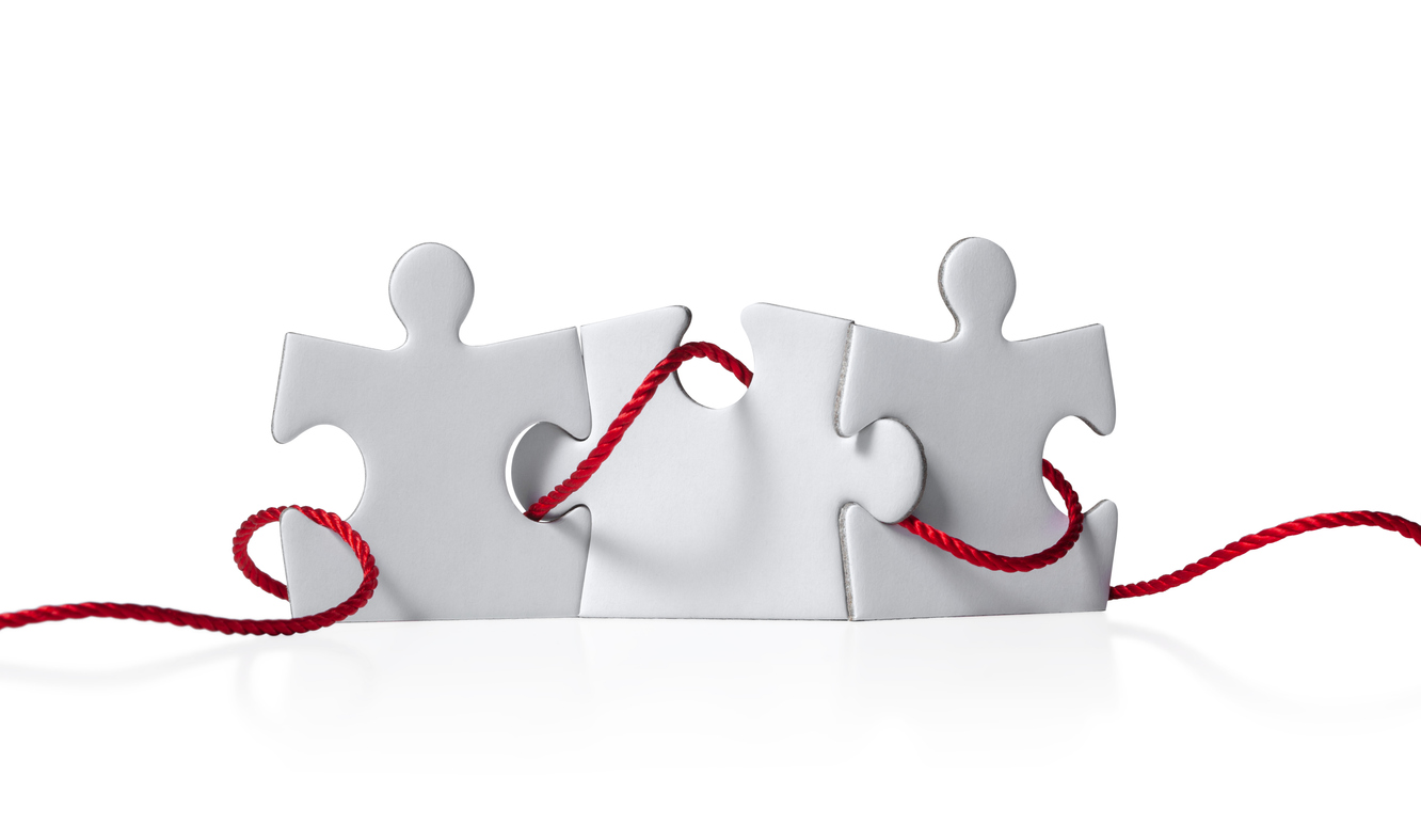 Three puzzle pieces connected by a red thread isolated on white background. Brands are switching Threads' posting strategies.