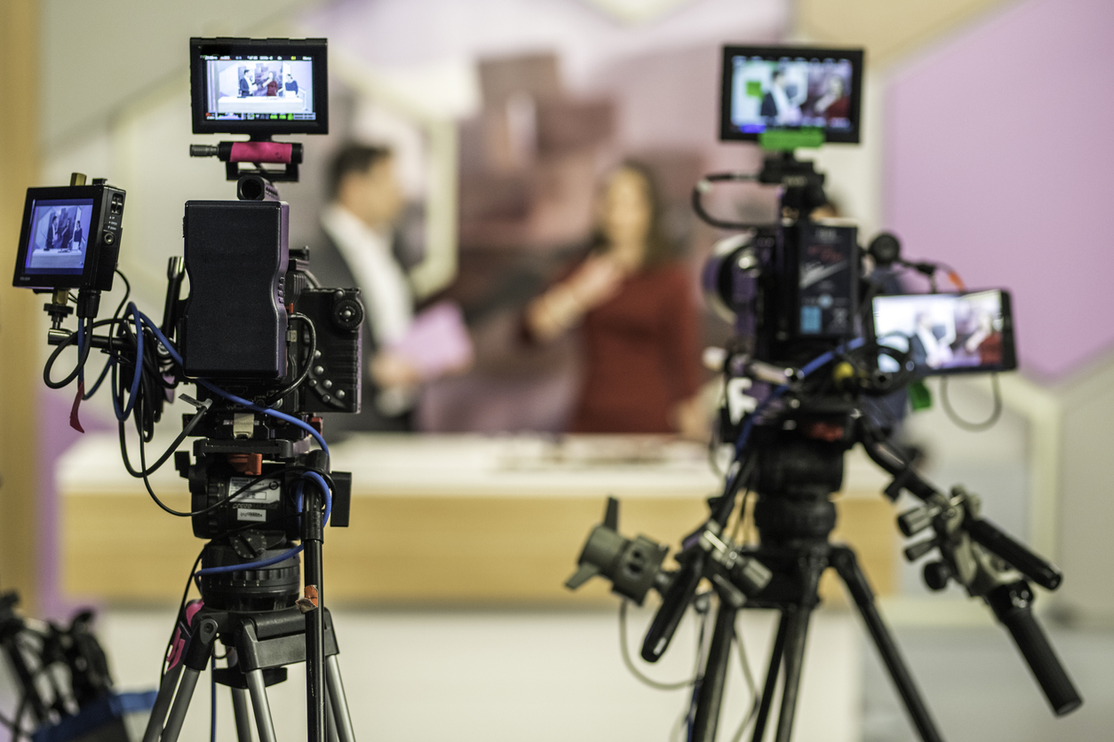 Rear view of two cameras filming an infomercial TV-show. Drew Barrymore is bringing back her talk show amidst controversy.