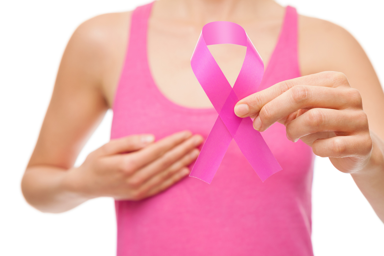 Woman with a pink breast cancer awareness ribbon.