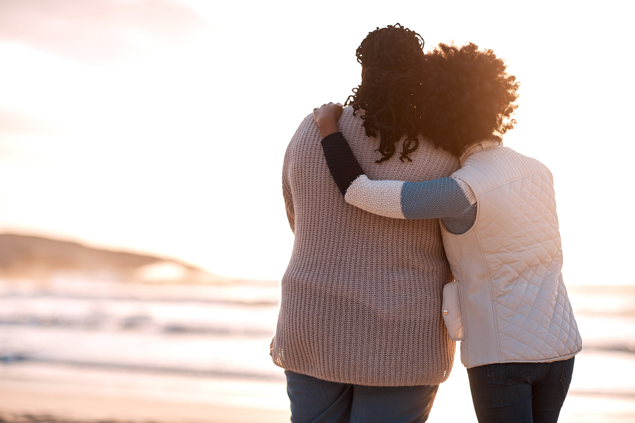 (By the Numbers: What more kid-free homes means for the future of PR) Two people on a beach looking at the ocean.)