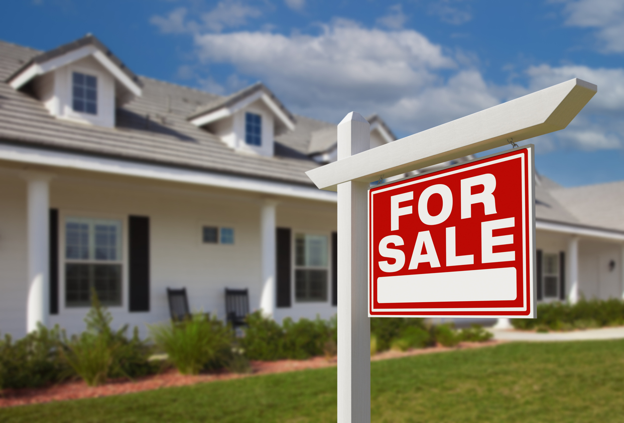 For Sale Real Estate Sign in Front of New House. (Media blitz helps real estate industry address major industry upheaval)